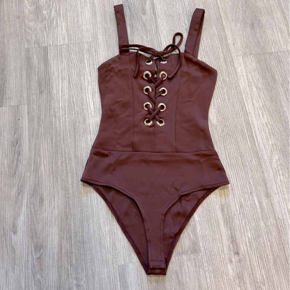 CHARLOTTE RUSSE burgundy one piece lace up bodysuit. New condition. Bottom snaps - Picture 6 of 6